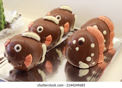 Chocolate figures in the shape of a fish or a blowfish. Chocolate pieces to put on top of the Mona de Pascua cake. Typical tradition of the easter holidays in the Spanish and Catalan culture.