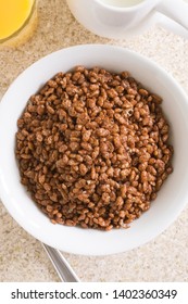 Chocolate Flavoured Crispy Rice Breakfast Cereal In A White Bowl Top Down View