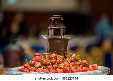 Chocolate Fountain  And Strawberry On Party.