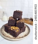 Chocolate fudge brownie cake, front view on white background

