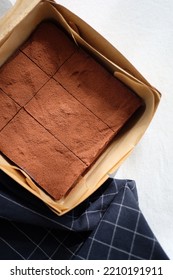 Chocolate Fudge Brownie In A Paper Box.