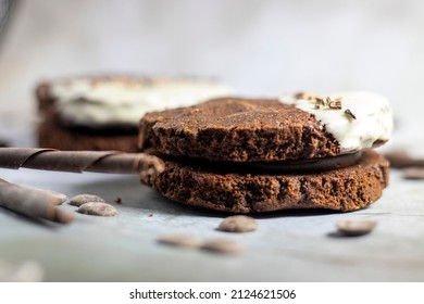 Chocolate Fudge Cookie Sandwich With White Chocolate Decoration