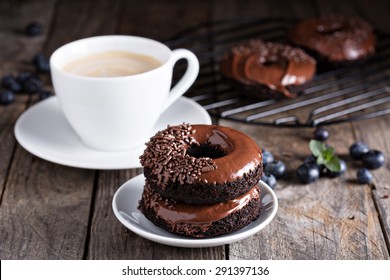 Chocolate gluten free donuts with coffee and blueberries - Powered by Shutterstock