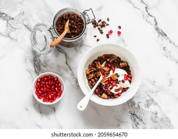 Chocolate granola with greek yogurt, pomegranate, dried figs - delicious breakfast on a light background, top view       - Powered by Shutterstock