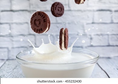 Chocolate Handmade Cookie Like Oreo Falling And Splashing In Milk