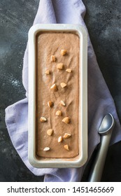 Chocolate Homemade Ice Cream In Metallic Container On Black Vintage Background. View From Above. Clean Eating. Without Sugar.