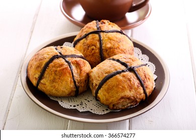 Chocolate Hot Cross Buns On Plate And Cup Of Tea