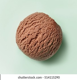 Chocolate Ice Cream Ball On Green Background, Top View