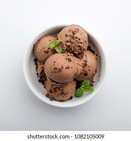 Chocolate ice cream on white wooden background. top view.