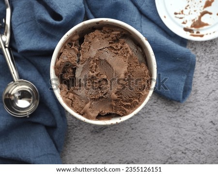 Chocolate ice cream in quart container at top view 