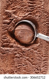 Chocolate Ice Cream Scooped Out From Container