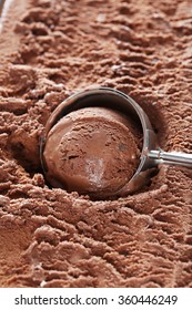 Chocolate Ice Cream Scooped Out From Container