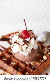 Chocolate Ice Cream Sundae On Waffle Iclose-up Around By Chocolate Sauce
