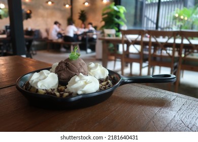 Chocolate Ice Cream And Whip Cream In Pan