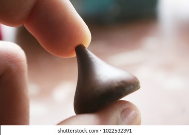Chocolate Kiss In Hand Close Up