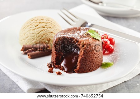 Chocolate lava cake with ice cream served on plate