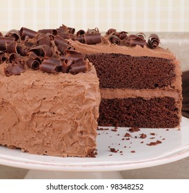 Chocolate Layer Cake With Chocolate Curls On Top On A Platter