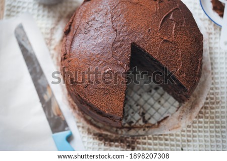 Chocolate layered cake. Dark chocolate cake made on buttermilk and cola