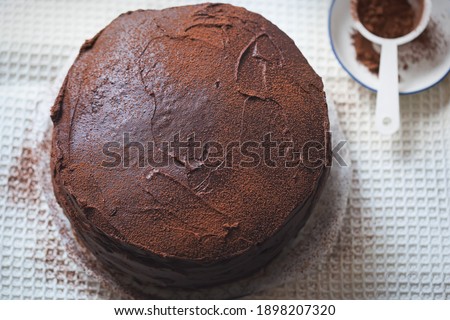 Chocolate layered cake. Dark chocolate cake made on buttermilk and cola
