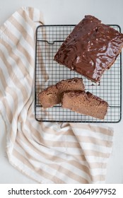 Chocolate Loaf Cake With Chocolate Dressing On White Background. Chocolate Cake Slices