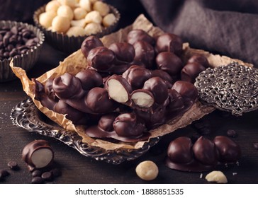 Chocolate and macadamia clusters on a dark background - Powered by Shutterstock