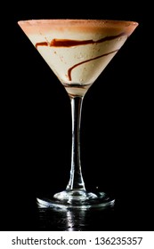 Chocolate Martini Isolated On A Black Background With Chocolate Swirl And Cocoa Powder On The Rim