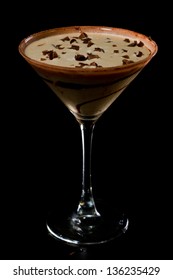 Chocolate Martini Isolated On A Black Background With Chocolate Swirl And Cocoa Powder On The Rim