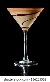 Chocolate Martini Isolated On A Black Background With Chocolate Swirl And Cocoa Powder On The Rim