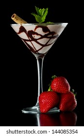 Chocolate Martini Served Isolated On A Black Background With Chocolate Swirl And A Wafer Stick