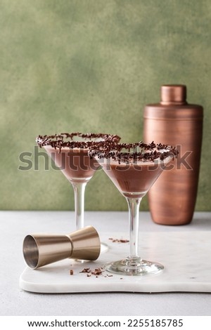 Chocolate martini with chocolate sprinkles on the glass rim with copy space