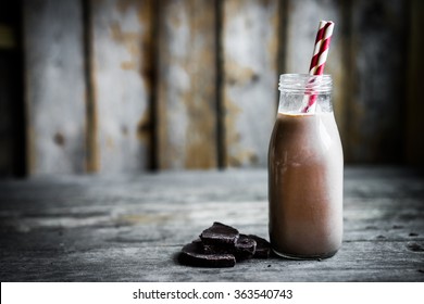 Chocolate Milk In A Jar On Wooden Background