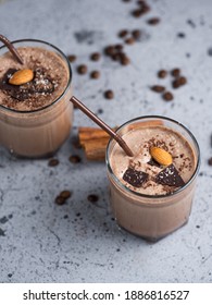 Chocolate milk smoothie cocktail with almonds, cinnamon and coffee