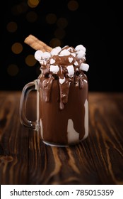 Chocolate Milkshake With Ice Cream And With Whipped Cream, Marshmallow, Cookies, Waffles, Served In Glass Mason Jar. 