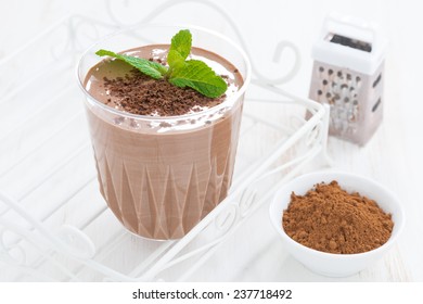 chocolate milkshake and ingredients, horizontal, close-up