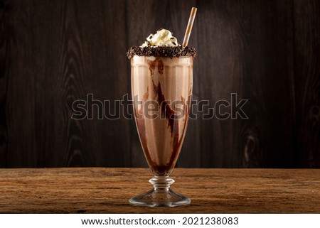 Chocolate milkshake with whipped cream.
