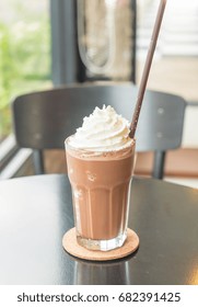 Chocolate Milkshake With Whipped Cream In Cafe