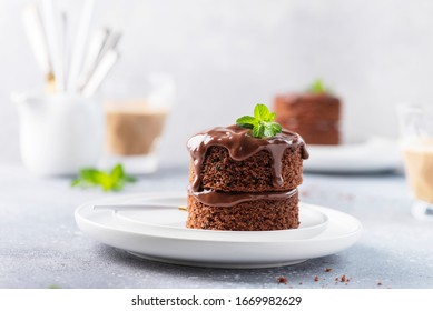 Chocolate mini cake with chocolate ganash and mint, selective focus image
