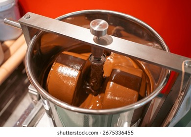 Chocolate mixing container in conching machine for smooth production, Stainless steel vessel blending cocoa in chocolate manufacturing process