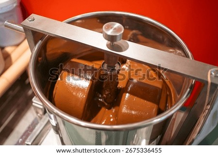 Chocolate mixing container in conching machine for smooth production, Stainless steel vessel blending cocoa in chocolate manufacturing process