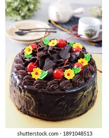 Chocolate Mousse Cake With Chocolate Ganache On Top And Flowers Chocolate Mousse Decoration With Cherry And Gratter Chocolated As Topping