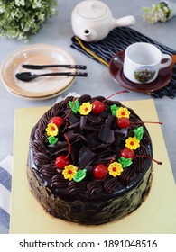 Chocolate Mousse Cake With Chocolate Ganache On Top And Flowers Chocolate Mousse Decoration With Cherry And Gratter Chocolated As Topping