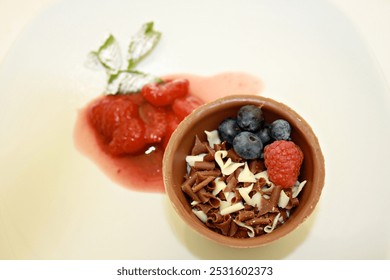 Chocolate mousse dessert in pot made of chocolate with fresh fruit - Powered by Shutterstock