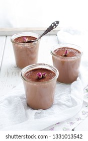 Chocolate Mousse In Glass Jars On The Light Background