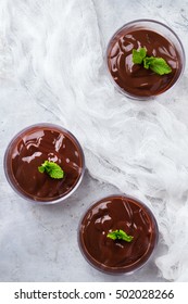 Chocolate Mousse With Mint In Glass On Rustic Table