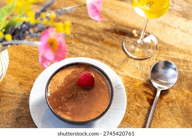Chocolate Mousse with Raspberry on Rustic Wooden Table