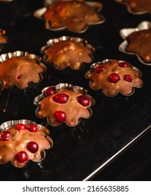 Chocolate Muffin With Cranberry In Hot Oven. Healthy Gluten Free Muffins With Cranberreis.