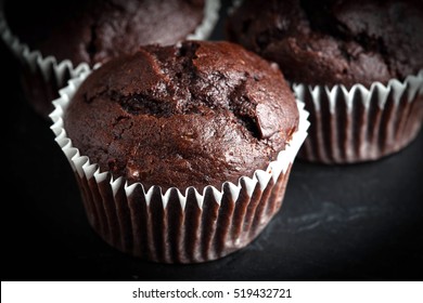 Chocolate muffin on dark background. Shallow depth of field.