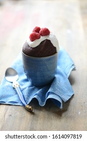 Chocolate Mug Cake With Cream And Raspberry