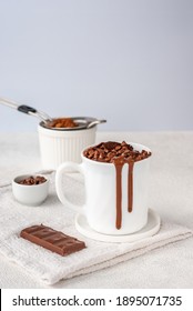 Chocolate Mug Cake In White Cup With Chocolate Drops And Coca Powder