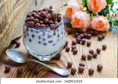 chocolate multislake balls with milk in a glass. delicious sweet breakfast